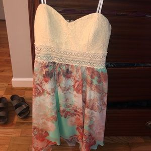 A colorful strapless sun dress.